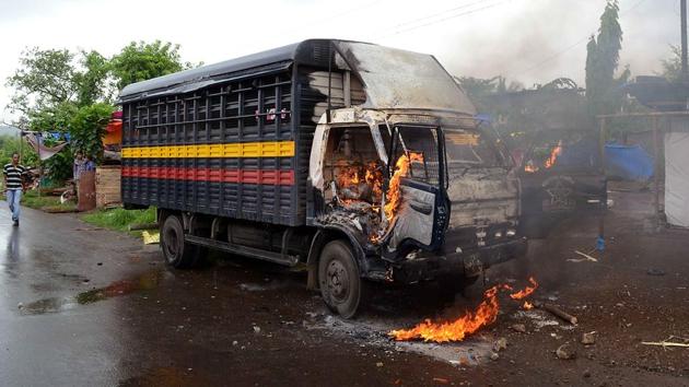 When a police team tried to enter the Bhal village, the mob ran up to a police van and set it ablaze. The police were forced to retreat. (Rishikesh Choudhary/HT PHOTO) 