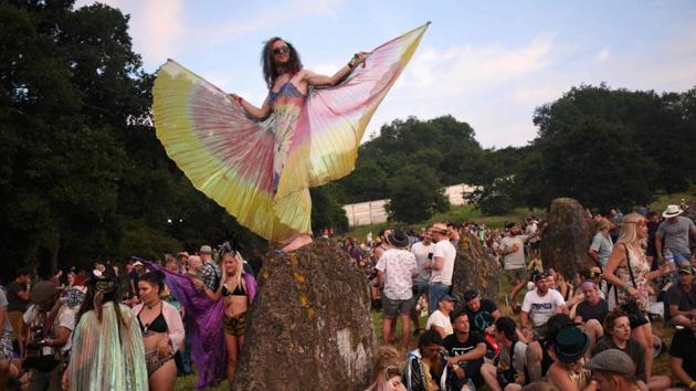 Festival goers gather in the Stone Circle to watch the sun set at the Glastonbury Festival in Somerset, England.The gates to the festival opened on Wednesday for five days of the world’s biggest greenfield music fest headlined this year by Radiohead, the Foo Fighters and Ed Sheeran among many others. Besides contemporary music, the festival is also known to host other performing arts. (AFP) Festival goers gather in the Stone Circle to watch the sun set at the Glastonbury Festival in Somerset, England.The gates to the festival opened on Wednesday for five days of the world’s biggest greenfield music fest headlined this year by Radiohead, the Foo Fighters and Ed Sheeran among many others. Besides contemporary music, the festival is also known to host other performing arts. (AFP)