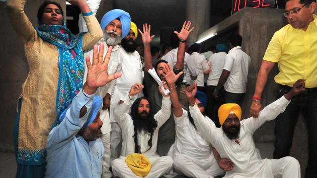 AAP MLAs protesting forceful removal from Punjab assembly at Punjab Vidhan Sabha in Chandigarh on Thursday. (Sanjeev Sharma/HT Photo) AAP MLAs protesting forceful removal from Punjab assembly at Punjab Vidhan Sabha in Chandigarh on Thursday. (Sanjeev Sharma/HT Photo)