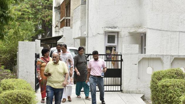 Relatives of the retired army man step out of his residence on Thursday. He is believed to have been dead for three days. (Virendra Singh Gosain/HT Photo) Relatives of the retired army man step out of his residence on Thursday. He is believed to have been dead for three days. (Virendra Singh Gosain/HT Photo)
