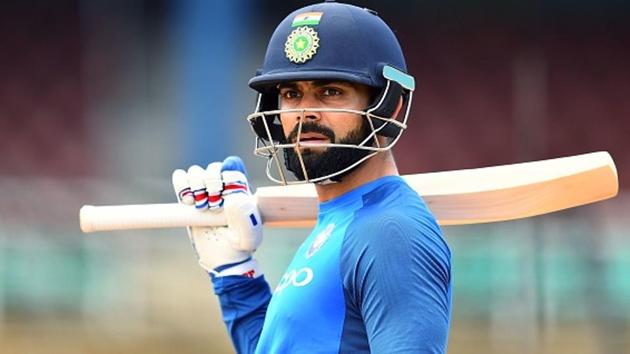 India's captain Virat Kohli arrives to bat during a practice session at the Queen's Park Oval in Port of Spain. (AFP/Getty Images)