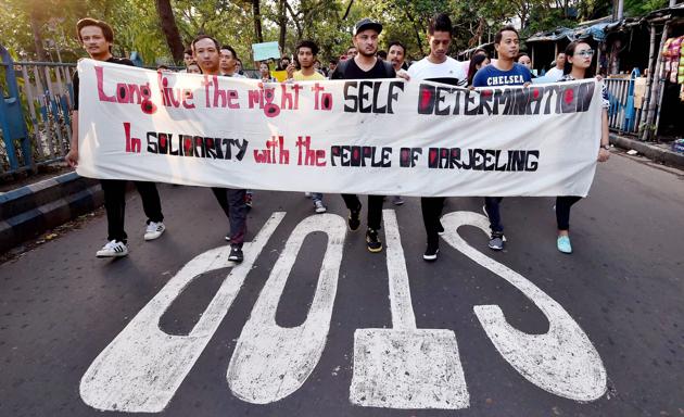 Kolkata: People of Darjeeling Hills and adjacent regions hold posters and participate in a silent rally in Kolkata on Tuesday to express solidarity with the people of Darjeeling. PTI Photo by Swapan Mahapatra (PTI6_20_2017_000154B) (PTI) Kolkata: People of Darjeeling Hills and adjacent regions hold posters and participate in a silent rally in Kolkata on Tuesday to express solidarity with the people of Darjeeling. PTI Photo by Swapan Mahapatra (PTI6_20_2017_000154B) (PTI)