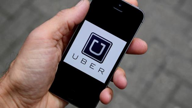 FILE PHOTO: A photo illustration shows the Uber app logo displayed on a mobile telephone, as it is held up for a posed photograph in central London, Britain October 28, 2016. REUTERS/Toby Melville/Illustration/File Photo (REUTERS) FILE PHOTO: A photo illustration shows the Uber app logo displayed on a mobile telephone, as it is held up for a posed photograph in central London, Britain October 28, 2016. REUTERS/Toby Melville/Illustration/File Photo (REUTERS)