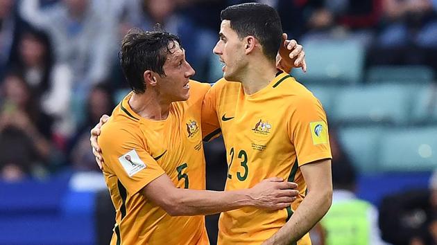 Australia's Mark Milligan (L) is congratulated by Tommy Rogic after scoring a goal during the FIFA Confederations Cup group B football match against Cameroon.(AFP)