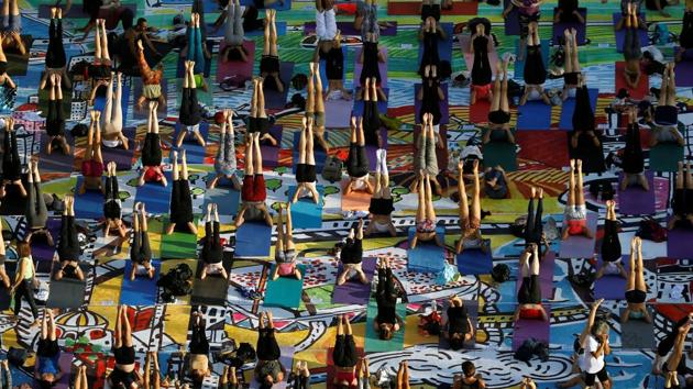 People practice yoga on 1500 yoga mats, printed with an artwork and placed together to form the artwork, during an event marking International Yoga Day, at Rabin Square in Tel Aviv, Israel June 21, 2017. REUTERS/Amir Cohen(REUTERS) People practice yoga on 1500 yoga mats, printed with an artwork and placed together to form the artwork, during an event marking International Yoga Day, at Rabin Square in Tel Aviv, Israel June 21, 2017. REUTERS/Amir Cohen(REUTERS)