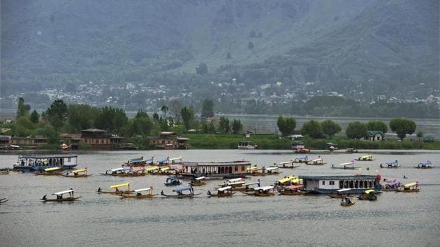 Boatmen row their boats during a shikara festival at Dal Lake in Srinagar organised by the Jammu and Kashmir government to promote tourism.(PTI File Photo) Boatmen row their boats during a shikara festival at Dal Lake in Srinagar organised by the Jammu and Kashmir government to promote tourism.(PTI File Photo)