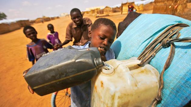 South Sudanese refugees fill water jugs at Al-Nimir refugee camp in Sudan's east Dafur. (AFP) South Sudanese refugees fill water jugs at Al-Nimir refugee camp in Sudan's east Dafur. (AFP)