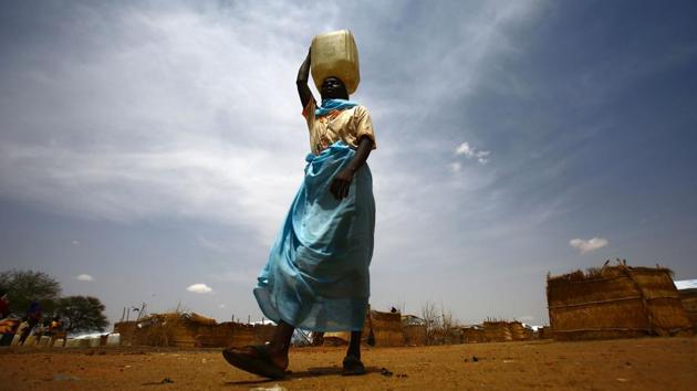 A South Sudanese woman carries a water jug at Al-Nimir refugee camp in Sudan's east Dafur. According to UNHCR 400,000 South Sudanese have arrived into Sudan since war erupted in the world’s youngest country. About half of them live across 10 camps in Sudan, while the rest are scattered in cities and towns. According to reports by the government and the UN released on Wednesday, South Sudan no longer has areas in famine but almost 2 million people are on the brink of starvation and an estimated 6 million people which is half the population are facing extreme food insecurity. (AFP) A South Sudanese woman carries a water jug at Al-Nimir refugee camp in Sudan's east Dafur. According to UNHCR 400,000 South Sudanese have arrived into Sudan since war erupted in the world’s youngest country. About half of them live across 10 camps in Sudan, while the rest are scattered in cities and towns. According to reports by the government and the UN released on Wednesday, South Sudan no longer has areas in famine but almost 2 million people are on the brink of starvation and an estimated 6 million people which is half the population are facing extreme food insecurity. (AFP)