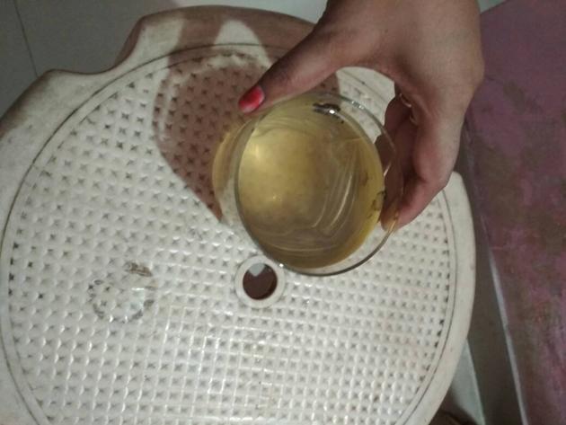 A Nerul resident residents shows the dirty water they have been getting for the past three days (HT photo) A Nerul resident residents shows the dirty water they have been getting for the past three days (HT photo)