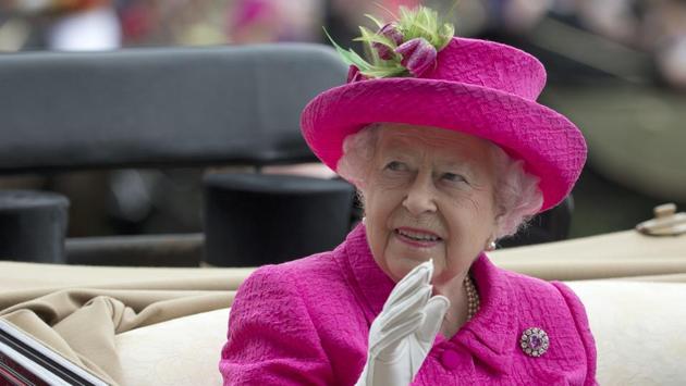 Britain's Queen Elizabeth II waves to the crowd as she arrives by open carriage into the parade ring on the third day of the Royal Ascot horse race meeting, which is traditionally known as Ladies Day, in Ascot, England. Every year Royal Ascot is attended by Elizabeth II and other members of the British Royal Family such as The Prince of Wales, arriving each day in a horse-drawn carriage with the Royal procession taking place at the start of each race day and the raising of the Queen’s Royal Standard. (Alastair Grant / AP) Britain's Queen Elizabeth II waves to the crowd as she arrives by open carriage into the parade ring on the third day of the Royal Ascot horse race meeting, which is traditionally known as Ladies Day, in Ascot, England. Every year Royal Ascot is attended by Elizabeth II and other members of the British Royal Family such as The Prince of Wales, arriving each day in a horse-drawn carriage with the Royal procession taking place at the start of each race day and the raising of the Queen’s Royal Standard. (Alastair Grant / AP)