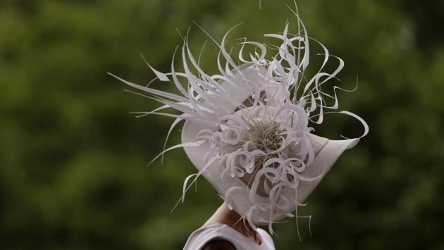 Barbra Studwick wears a white and feather ornate hat on the third day of the Royal Ascot horse race. (Alastair Grant / AP) Barbra Studwick wears a white and feather ornate hat on the third day of the Royal Ascot horse race. (Alastair Grant / AP)