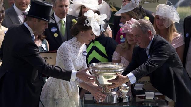 Britain's Prince William, left, and Kate, the Duchess of Cambridge present the trophy for the King's Stand Stakes to the Wesley A. Ward trainer of the winning horse Lady Aurelia of the United States, ridden by John Velazquez, in the parade ring on the first day o the Royal Ascot horse race meeting in Ascot, England. (Alastair Grant / AP) Britain's Prince William, left, and Kate, the Duchess of Cambridge present the trophy for the King's Stand Stakes to the Wesley A. Ward trainer of the winning horse Lady Aurelia of the United States, ridden by John Velazquez, in the parade ring on the first day o the Royal Ascot horse race meeting in Ascot, England. (Alastair Grant / AP)