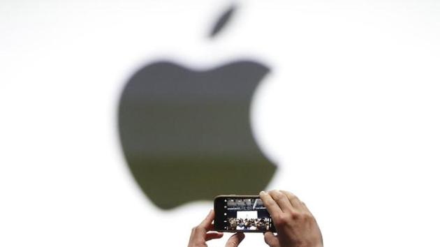 An audience member takes a photo of the Apple logo before the start of the company's annual developer conference in San Jose, California.(Reuters file photo)
