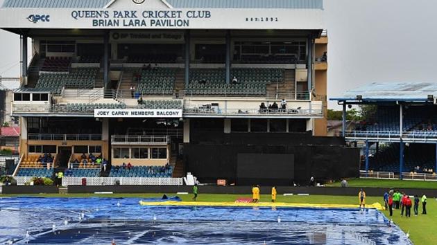 Match officials inspect the wet field as rain interrupt play of the first One Day International (ODI) match between West Indies and India. Catch full cricket score of India vs West Indies 2017, 1st ODI here(AFP/Getty Images)