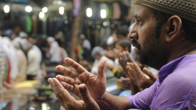 A man raises his hands in prayer during Juma-tul-Wida in Kolkata, West Bengal. (Samir Jana/HT PHOTO) A man raises his hands in prayer during Juma-tul-Wida in Kolkata, West Bengal. (Samir Jana/HT PHOTO)
