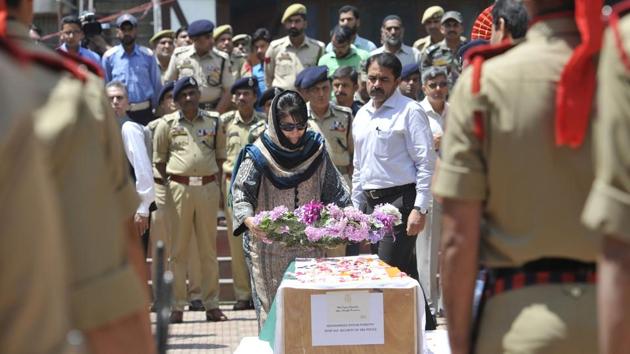 Jammu and Kashmir Chief Minister Mehbooba Mufti lays a wreath on the coffin of deputy superintendent of police Mohammad Ayoub Pandith, police headquarters, Srinagar, June 23(Waseem Andrabi HT) Jammu and Kashmir Chief Minister Mehbooba Mufti lays a wreath on the coffin of deputy superintendent of police Mohammad Ayoub Pandith, police headquarters, Srinagar, June 23(Waseem Andrabi HT)