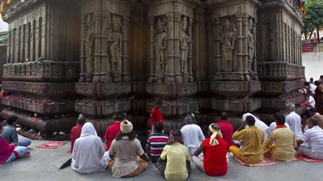 People gather to pray at the Kamakhya temple on the occasion of Ambubachi Mela in Guwahati,India. The temple is closed till Sunday to celebrate the yearly menstruation course of goddess Kamkhya. Sadhus’ and devotees from all over the country and abroad have arrived at the temple atop the Nilachal Hills with the district administration making elaborate arrangements to ensure smooth functioning of the festival. (AP) People gather to pray at the Kamakhya temple on the occasion of Ambubachi Mela in Guwahati,India. The temple is closed till Sunday to celebrate the yearly menstruation course of goddess Kamkhya. Sadhus’ and devotees from all over the country and abroad have arrived at the temple atop the Nilachal Hills with the district administration making elaborate arrangements to ensure smooth functioning of the festival. (AP)