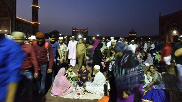 A family sits down at iftar time as a swarm of people moves around them at Old Delhi’s Jama Masjid. (Arun Sharma/HT PHOTO) A family sits down at iftar time as a swarm of people moves around them at Old Delhi’s Jama Masjid. (Arun Sharma/HT PHOTO)