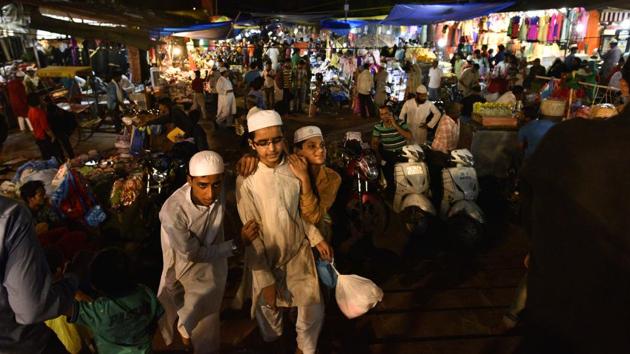 A young trio carries their shopping out from a market coming alive with Eid around the corner. (Arun Sharma/HT PHOTO) A young trio carries their shopping out from a market coming alive with Eid around the corner. (Arun Sharma/HT PHOTO)