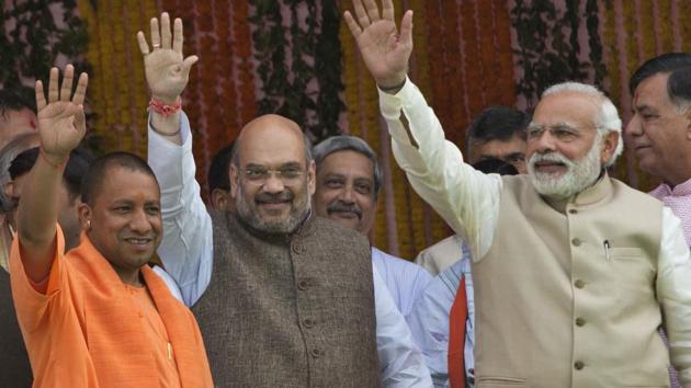 (R-L) Bharatiya Janata Party president Amit Shah, Yogi Adityanath and Prime Minister Narendra Modi, after Adityanath was sworn in as Uttar Pradesh chief minister in Lucknow, on March 19, 2017. (AP File Photo) (R-L) Bharatiya Janata Party president Amit Shah, Yogi Adityanath and Prime Minister Narendra Modi, after Adityanath was sworn in as Uttar Pradesh chief minister in Lucknow, on March 19, 2017. (AP File Photo)