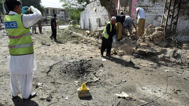 Pakistani police inspect the site of a powerful explosion that targeted a police vehicle in Quetta. (AFP Photo) Pakistani police inspect the site of a powerful explosion that targeted a police vehicle in Quetta. (AFP Photo)