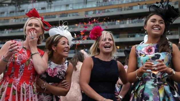 Horse racing has been held at the famous Berkshire course since 1711 and tradition is a hallmark of the meeting. Top hats and tails remain compulsory in parts of the course while a daily procession of horse-drawn carriages brings the Queen to the course. (Daniel LEAL-OLIVAS / AFP) Horse racing has been held at the famous Berkshire course since 1711 and tradition is a hallmark of the meeting. Top hats and tails remain compulsory in parts of the course while a daily procession of horse-drawn carriages brings the Queen to the course. (Daniel LEAL-OLIVAS / AFP)