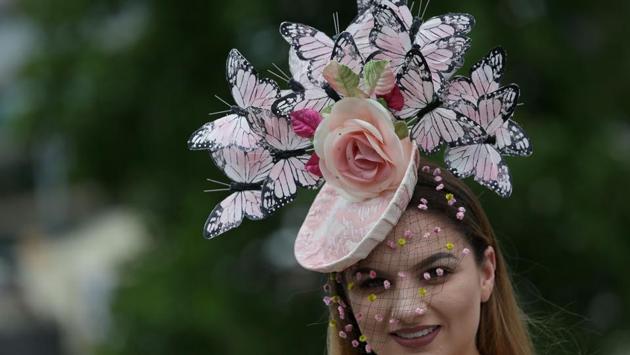 Racegoers attend Ladies Day at the Royal Ascot horse racing meet, in Ascot, west of London. (Daniel LEAL-OLIVAS / AFP) Racegoers attend Ladies Day at the Royal Ascot horse racing meet, in Ascot, west of London. (Daniel LEAL-OLIVAS / AFP)