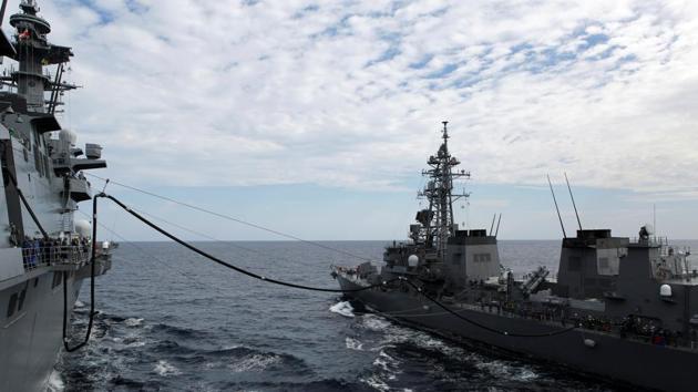 Japan Maritime Self-Defense Force (JMSDF) helicopter carrier Izumo (L) receives fuel replenishment from JMSDF Takanami class destroyer Sazanami during a military exercise in South China Sea, near Singapore, June 20, 2017. (REUTERS) Japan Maritime Self-Defense Force (JMSDF) helicopter carrier Izumo (L) receives fuel replenishment from JMSDF Takanami class destroyer Sazanami during a military exercise in South China Sea, near Singapore, June 20, 2017. (REUTERS)