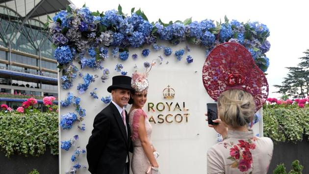Racegoers take photo during Ladies Day at Ascot . (Toby Melville / Reuters) Racegoers take photo during Ladies Day at Ascot . (Toby Melville / Reuters)