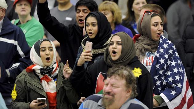 FILE PHOTO - Young Muslims protest against U.S. Republican presidential candidate Donald Trump before being escorted out during a campaign rally in the Kansas Republican Caucus at the Century II Convention and Entertainment Center in Wichita, Kansas March 5, 2016. (REUTERS) FILE PHOTO - Young Muslims protest against U.S. Republican presidential candidate Donald Trump before being escorted out during a campaign rally in the Kansas Republican Caucus at the Century II Convention and Entertainment Center in Wichita, Kansas March 5, 2016. (REUTERS)