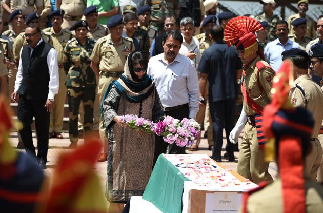 Jammu and Kashmir CM Mehbooba Mufti lays a wreath on the coffin of police officer Ayub Pandith during a ceremony in Srinagar on June 23, 2017. (AFP) Jammu and Kashmir CM Mehbooba Mufti lays a wreath on the coffin of police officer Ayub Pandith during a ceremony in Srinagar on June 23, 2017. (AFP)
