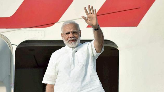 Prime Minister Narendra Modi waves as he emplanes in New Delhi on Saturday for his visit to Portugal, the US and the Netherlands. (PTI) Prime Minister Narendra Modi waves as he emplanes in New Delhi on Saturday for his visit to Portugal, the US and the Netherlands. (PTI)