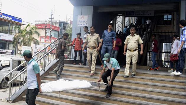 The body was spotted around 5.30am by a train operator, on way to New Delhi from Noida City Centre Metro station. (HT Photo) The body was spotted around 5.30am by a train operator, on way to New Delhi from Noida City Centre Metro station. (HT Photo)