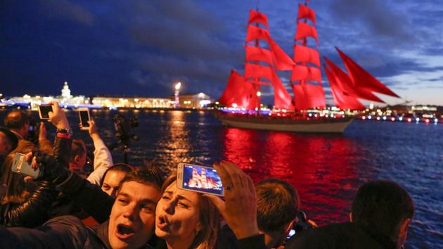 In late June, comes a grandiose holiday for all graduates - the Scarlet Sails, when more than 1.5 million people, the residents and the guests come to the Palace Square and to the banks of the Neva River to watch the performance. (Elena Ignatyeva / AP)