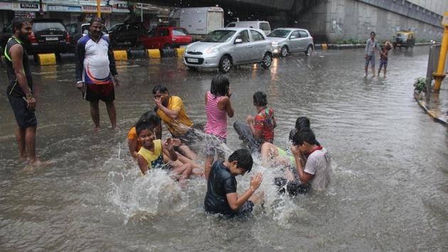 Children are delighted by their makeshift pool. (Bhushan Koyande/HT) 