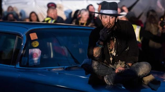 Actor Johnny Depp arrives to introduce his film, The Libertine, to the audience at 'Cineramageddon', the outdoor cinema venue, at the Glastonbury Festival of Music and Performing Arts on Worthy Farm near the village of Pilton in Somerset, South West England, on June 22, 2017. (Oli Scarff/AFP)