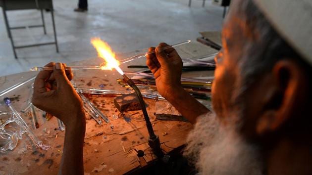 An artisan attends a government-run training workshop to learn new techniques in glass art at Firozabad. (AFP Photo) An artisan attends a government-run training workshop to learn new techniques in glass art at Firozabad. (AFP Photo)