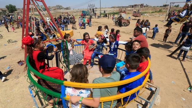 Iraqi children play as they celebrate Eid al-Fitr, in Mosul, Iraq on Sunday. (Reuters Photo) Iraqi children play as they celebrate Eid al-Fitr, in Mosul, Iraq on Sunday. (Reuters Photo)