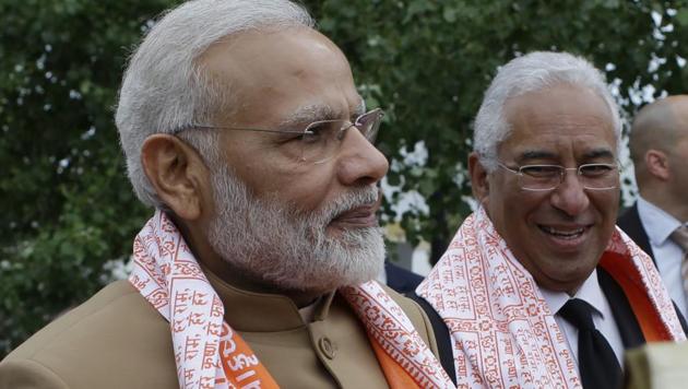 Prime Minister Narendra Modi and Portuguese Prime Minister Antonio Costa, right, stand together after being given ceremonial shawls during a visit to the Radha Krishna Temple in Lisbon. Modi visited Portugal in the first leg of his three-nation tour -- before heading for the US. (AP) Prime Minister Narendra Modi and Portuguese Prime Minister Antonio Costa, right, stand together after being given ceremonial shawls during a visit to the Radha Krishna Temple in Lisbon. Modi visited Portugal in the first leg of his three-nation tour -- before heading for the US. (AP)