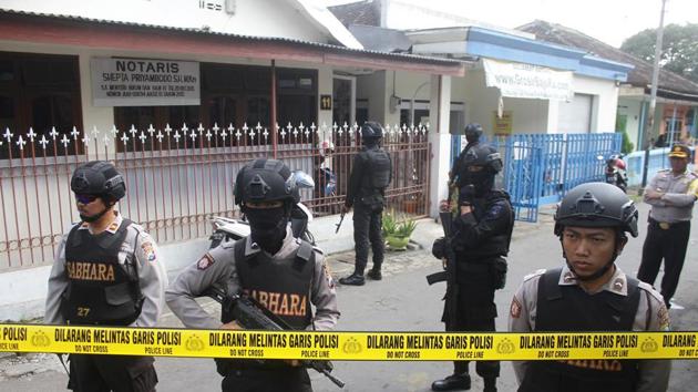 Police stand guard near the home of a suspected militant, following his arrest in Singosari District of Indonesia. (Reuters File Photo) Police stand guard near the home of a suspected militant, following his arrest in Singosari District of Indonesia. (Reuters File Photo)
