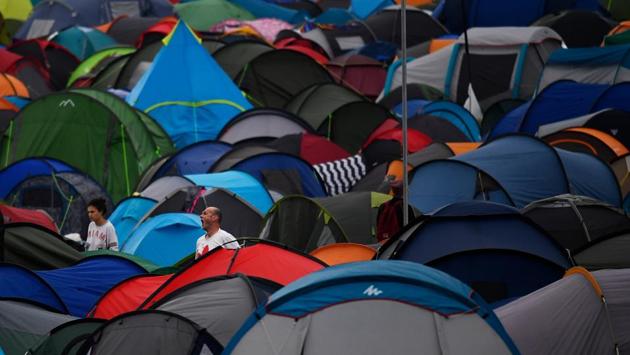 Revellers emerge from their tents at Worthy Farm in Somerset during the Glastonbury Festival, in Britain on June 22, 2017. (Dylan Martinez/REUTERS)