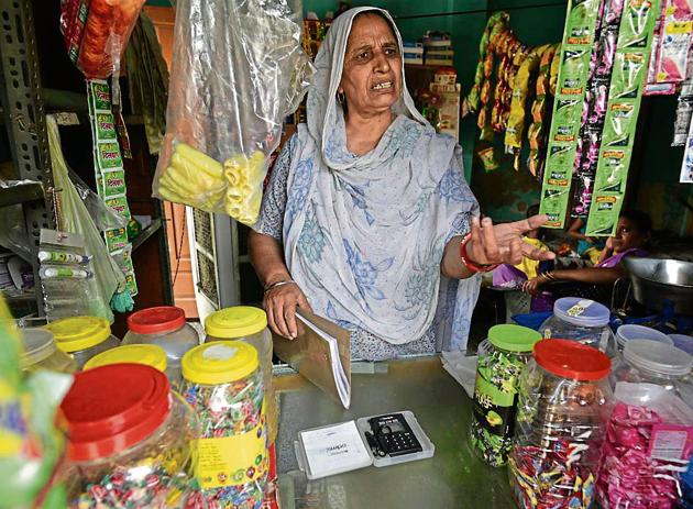 65-year-old Rajkor runs a shop in Surakhpur village. The swipe machine has hardly been used to accept payments because there is poor internet connectivity in the village. (Vipin Kumar/HT PHOTO) 65-year-old Rajkor runs a shop in Surakhpur village. The swipe machine has hardly been used to accept payments because there is poor internet connectivity in the village. (Vipin Kumar/HT PHOTO)