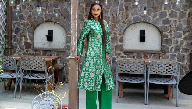 Model Devika Das pairs her emerald green Banarasi kurta with silk pants (Raw Mango) and temple inspired dangler earrings. (HT Photo/ Shara Ashraf; Styling: Shara Ashraf ) Model Devika Das pairs her emerald green Banarasi kurta with silk pants (Raw Mango) and temple inspired dangler earrings. (HT Photo/ Shara Ashraf; Styling: Shara Ashraf )