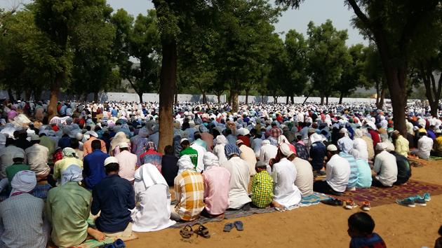 Muslims offer prayers on the occasion of Eid-ul-Fitr at Mewat on Monday.(HT PHOTO)