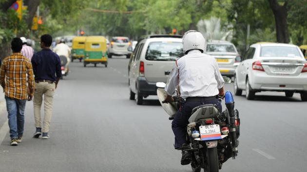 According to sources, the system was put in place to ensure more visibility of traffic cops on the field. The police department has already purchased 50 biometric systems(Burhaan Kinu/HT PHOTO)