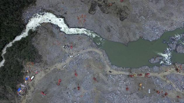 An aerial view of the landslide site. Officials have pulled bodies from the avalanche of rocks that crashed into 62 homes in Xinmo which was a once picturesque mountain village nestled by a river in Sichuan province. (AFP) An aerial view of the landslide site. Officials have pulled bodies from the avalanche of rocks that crashed into 62 homes in Xinmo which was a once picturesque mountain village nestled by a river in Sichuan province. (AFP)