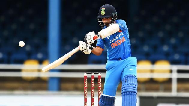 India's Ajinkya Rahane hits a boundary during the second One Day International (ODI) match between West Indies and India at the Queen's Park Oval in Port of Spain, Trinidad.(AFP)