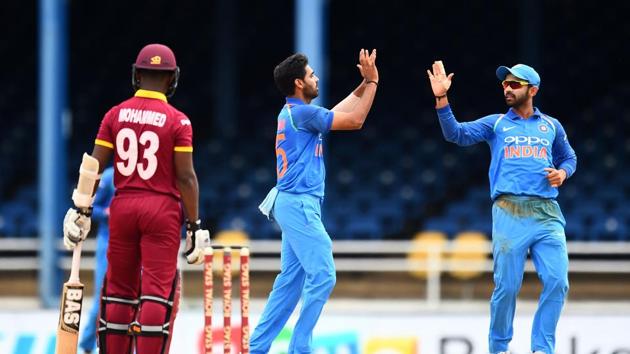 In response, Bhuvneshwar Kumar struck twice to remove Kieran Powell and Jason Mohammed for 0. (AFP) In response, Bhuvneshwar Kumar struck twice to remove Kieran Powell and Jason Mohammed for 0. (AFP)
