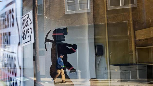 A mural of a coal miner stands in an empty storefront as signs advertising vacant apartments and stores hang in the windows along the main business street in Cumberland in the United States. Reducing coal emissions was a critical piece of the 2015 Paris climate accord that Trump announced this month he wants to exit. (David Goldman/AP) A mural of a coal miner stands in an empty storefront as signs advertising vacant apartments and stores hang in the windows along the main business street in Cumberland in the United States. Reducing coal emissions was a critical piece of the 2015 Paris climate accord that Trump announced this month he wants to exit. (David Goldman/AP)