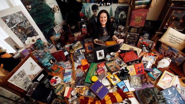Harry Potter fan Victoria Maclean poses amongst her collection of merchandise at her home in Neath, Britain. (Neil Hall/Reuters)